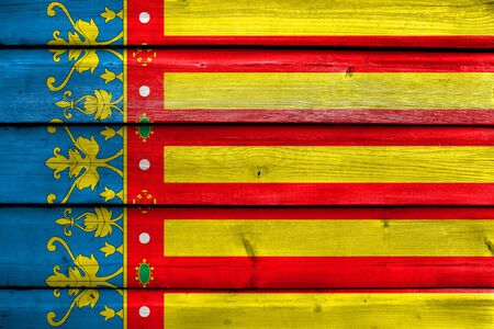 Flag of Valencian Community, Spain, painted on old wood plank backgroundの写真素材