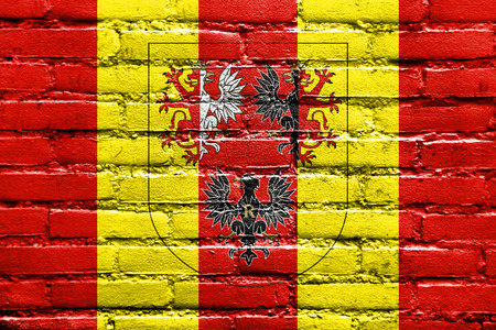 Flag of Lodz Voivodeship with Coat of Arms, Poland, painted on brick wallの写真素材