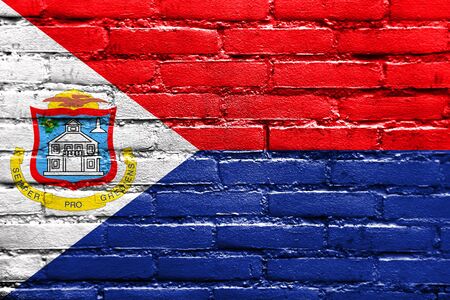 Flag of Sint Maarten, painted on brick wallの写真素材