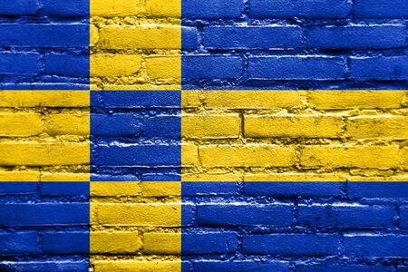 Flag of Tilburg, Netherlands, painted on brick wallの写真素材