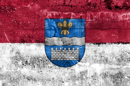 Flag of Daugavpils, Latvia, painted on dirty wallの写真素材