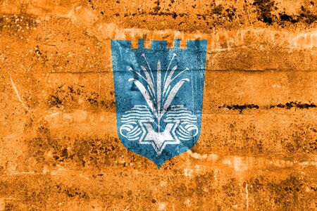 Flag of Netanya, Israel, painted on dirty wallの写真素材