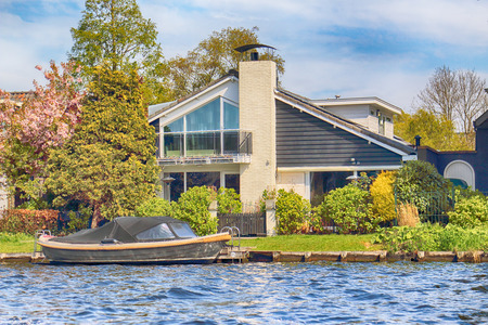 HAARLEM, NETHERLANDS - APR 30, 2017 : Canal with modern Dutch architecture. View from the boat level.のeditorial素材