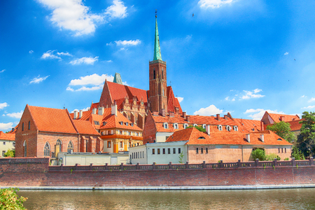 WROCLAW, POLAND - JULY 18, 2017: Wroclaw Old Town. Cathedral Island (Ostrow Tumski) is the oldest part of the city. Odra River, boats and historic buildings on a summer day.のeditorial素材