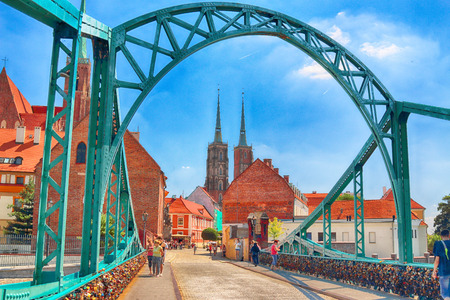 WROCLAW, POLAND - JULY 18, 2017: Wroclaw Old Town. Cathedral Island (Ostrow Tumski) is the oldest part of the city. Odra River, boats and historic buildings on a summer day.のeditorial素材