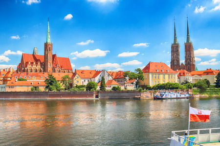 WROCLAW, POLAND - JULY 18, 2017: Wroclaw Old Town. Cathedral Island (Ostrow Tumski) is the oldest part of the city. Odra River, boats and historic buildings on a summer day.のeditorial素材
