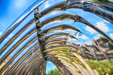 WROCLAW, POLAND - JULY 29, 2017: The NAWA sculpture designed by Oskar Zieta, erected on Daliowa Island. Due to polished steel surface NAWA reflects its surroundings (different feeling every time).のeditorial素材