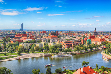 WROCLAW, POLAND - JULY 29, 2017: Aerial view of Wroclaw. Old Town and Cathedral Island (Ostrow Tumski) is the oldest part of the city. Odra River, boats and historic buildings on a summer day.のeditorial素材