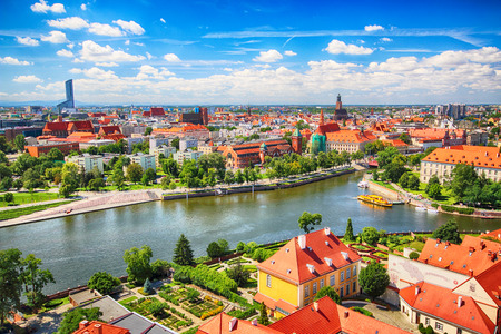 WROCLAW, POLAND - JULY 29, 2017: Aerial view of Wroclaw. Old Town and Cathedral Island (Ostrow Tumski) is the oldest part of the city. Odra River, boats and historic buildings on a summer day.のeditorial素材