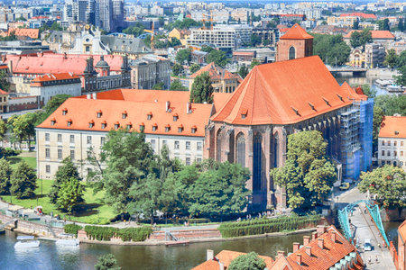 WROCLAW, POLAND - JULY 29, 2017: Aerial view of Wroclaw. Old Town and Cathedral Island (Ostrow Tumski) is the oldest part of the city. Odra River, boats and historic buildings on a summer day.のeditorial素材