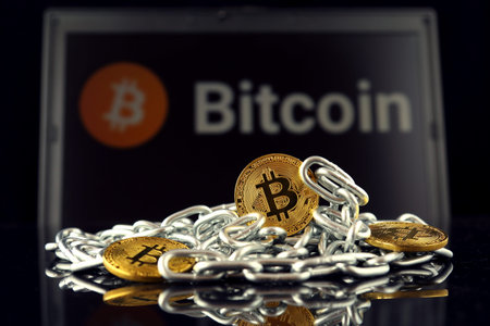 Physical version of Bitcoin (new virtual money) and chain. Conceptual image for investors in...