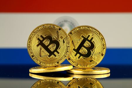 Physical version of Bitcoin and Paraguay Flag. Close up.の写真素材