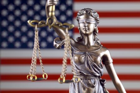 Symbol of law and justice with United States Flag. Close up.の写真素材