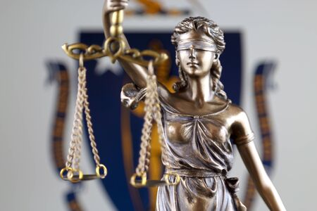 Symbol of law and justice with Massachusetts State Flag. Close up.の写真素材