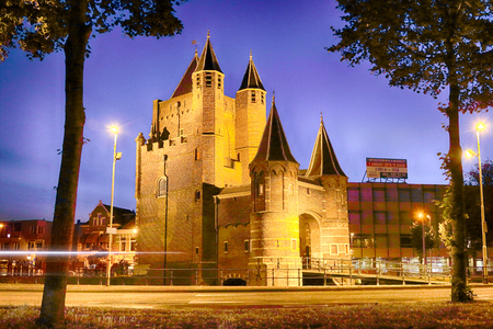 HAARLEM, NETHERLANDS - JULY 07, 2018 : The Amsterdamse Poort is an old city gate of Haarlem. Historical building in old Haarlem at night.のeditorial素材
