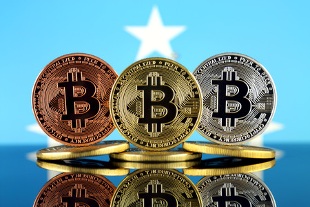 Physical version of Bitcoin (BTC) and Micronesia Flag. Conceptual image for investors in High Technology (Cryptocurrency, Blockchain Technology, Smart Contracts, ICO).の写真素材