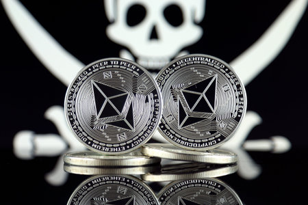 Physical version of Ethereum (ETH) and Pirate Flag. Conceptual image for investors in...