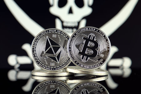 Physical version of Ethereum (ETH), Bitcoin (BTC) and Pirate Flag. 2 largest cryptocurrencies in terms of market capitalization. Risk, safety and security.の写真素材