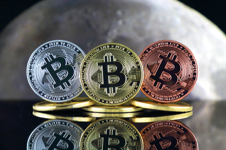 Bitcoin (BTC) and the moon. The saying TO THE MOON suggests an increase in the value of cryptocurrencies.の写真素材