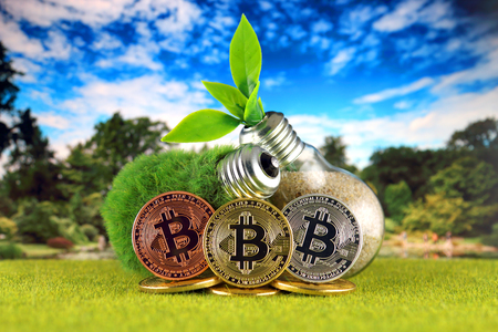 Bitcoin (BTC) and green, renewable energy concept. Electricity prices, energy saving in the cryptocurrency mining business.の写真素材