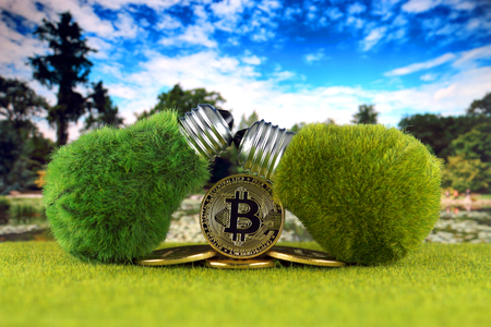 Bitcoin (BTC) and green, renewable energy concept. Electricity prices, energy saving in the cryptocurrency mining business.の写真素材