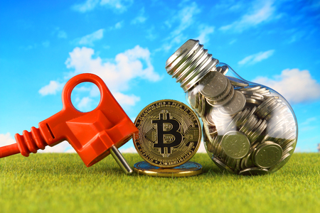 Bitcoin (BTC) and green, renewable energy concept. Electricity prices, energy saving in the cryptocurrency mining business.の写真素材