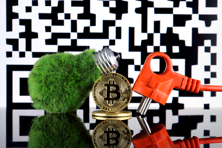 Bitcoin (BTC), QR Code and green, renewable energy concept. Electricity prices, energy saving in the cryptocurrency mining business.の写真素材