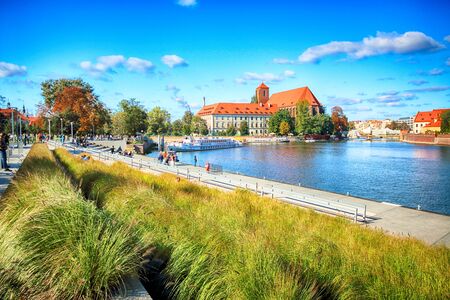 WROCLAW, POLAND - OCTOBER 06, 2019: Wroclaw Old Town. Cathedral Island (Ostrow Tumski) is the oldest part of the city. Odra River and historic buildings in sunny day.のeditorial素材