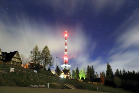 ZAKOPANE, POLAND - NOVEMBER 03, 2019: Night view of The Zakopane-Gubalowka transmitter (Polish: RTON Gubalowka ). Is located atop the Gubalowka mountain, popular tourist attraction, Poland, Europe.のeditorial素材