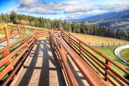 ZAKOPANE, POLAND - NOVEMBER 06, 2019: View of the city of Zakopane from Gubalowka, Poland, Europe. Gubalowka mountain is a popular tourist attraction, offering views of the Tatras and Zakopane.のeditorial素材