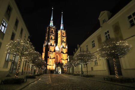 WROCLAW, POLAND - DECEMBER 15, 2019: The Cathedral of St. John the Baptist in Wroclaw, Poland, Europe. Cathedral Island (Ostrow Tumski) is the oldest part of the city. Night view.のeditorial素材