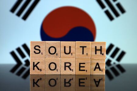 South Korea Flag and country name made of small wooden letters. Studio shot.の写真素材