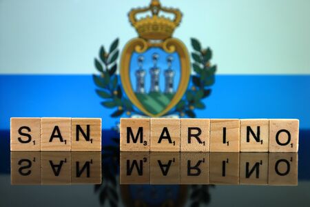San Marino Flag and country name made of small wooden letters. Studio shot.の写真素材