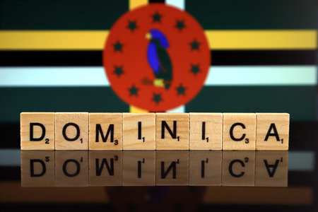 Dominica Flag and country name made of small wooden letters. Studio shot.の写真素材