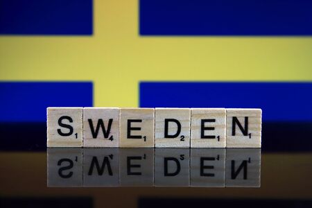 Sweden Flag and country name made of small wooden letters. Studio shot.の写真素材