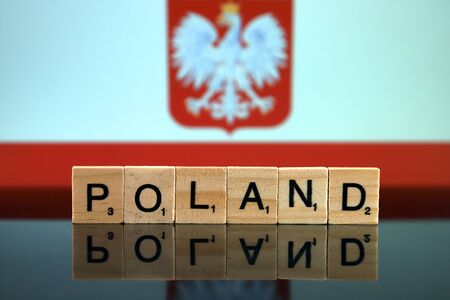 Poland Flag and country name made of small wooden letters. Studio shot.の写真素材