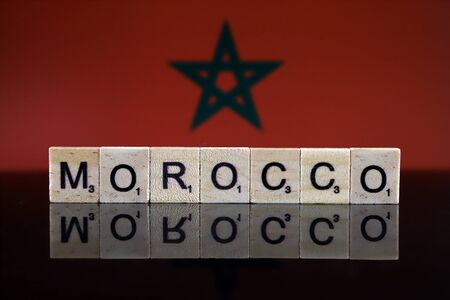 Morocco Flag and country name made of small wooden letters. Studio shot.の写真素材
