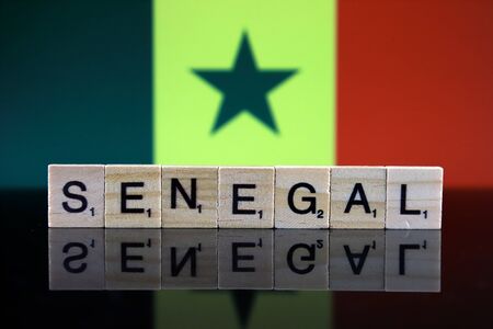 Senegal Flag and country name made of small wooden letters. Studio shot.の写真素材