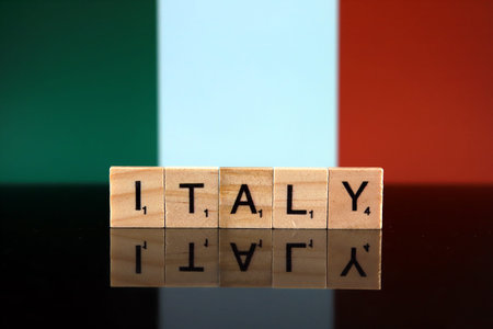 Italy Flag and country name made of small wooden letters. Studio shot.
