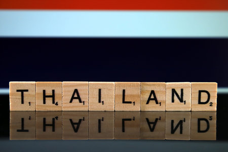Thailand Flag and country name made of small wooden letters. Studio shot.の写真素材