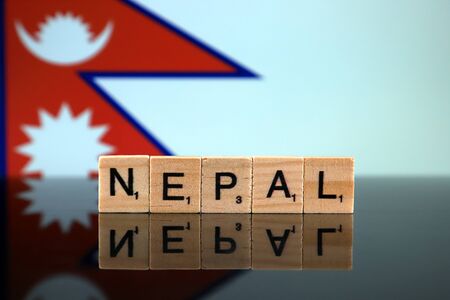 Nepal Flag and country name made of small wooden letters. Studio shot.の写真素材