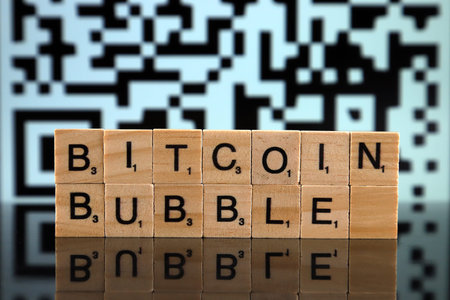 WROCLAW, POLAND - FEBRUARY 04, 2020: Words BITCOIN BUBBLE made of small wooden letters. Speculative...
