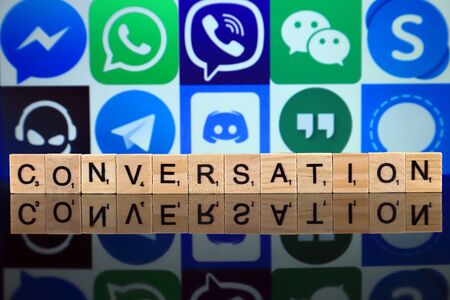 WROCLAW, POLAND - FEBRUARY 19, 2020: Word CONVERSATION made of wooden letters, and MESSENGER, WHATSAPP, VIBER, WECHAT, SKYPE, TEAMSPEAK, TELEGRAM, DISCORD, GOOGLE HANGOUTS, SIGNAL logos in the backgroundのeditorial素材