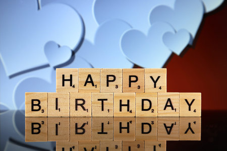 WROCLAW, POLAND - FEBRUARY 28, 2020: The words HAPPY BIRTHDAY made of scrabble letters and and...