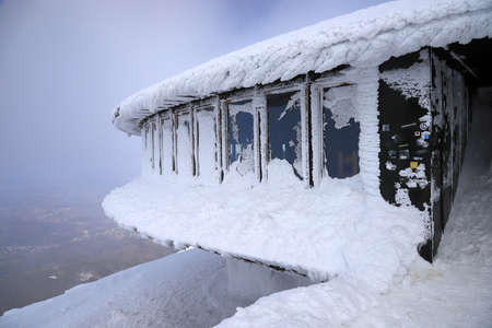 KARPACZ, POLAND - MARCH 08, 2020: A disc-shaped observatory with a weather station and restaurant was built in 1974, located on the peak of Sniezka mountain, Karkonosze National Park, Poland, Europe.のeditorial素材