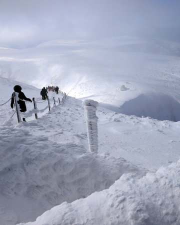 KARPACZ, POLAND - MARCH 08, 2020: Tourist trail to Sniezka (mountain on the border between the Czech...