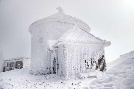 KARPACZ, POLAND - MARCH 08, 2020: St. Lawrence's Chapel in the Winter. A Roman Catholic chapel located on the peak of Sniezka mountain, Karkonosze National Park, Karpacz, Poland, Europe.のeditorial素材