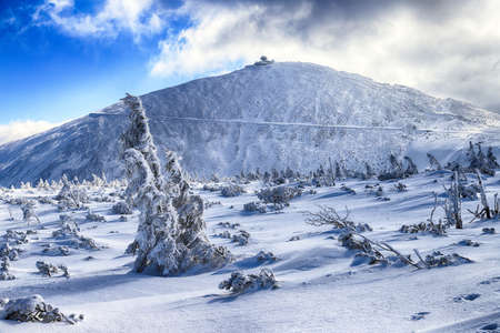 KARPACZ, POLAND - MARCH 08, 2020: Tourist trail to Sniezka (mountain on the border between the Czech Republic and Poland). Winter landscape. Giant Mountains, Poland, Europe.のeditorial素材