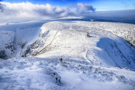 KARPACZ, POLAND - MARCH 08, 2020: Winter view from Sniezka mountain (1602 m. above sea level). In the background the Dom Slaski mountain shelter. Giant Mountains, Poland, Europe.のeditorial素材