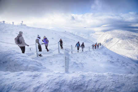 KARPACZ, POLAND - MARCH 08, 2020: Tourist trail to Sniezka (mountain on the border between the Czech...